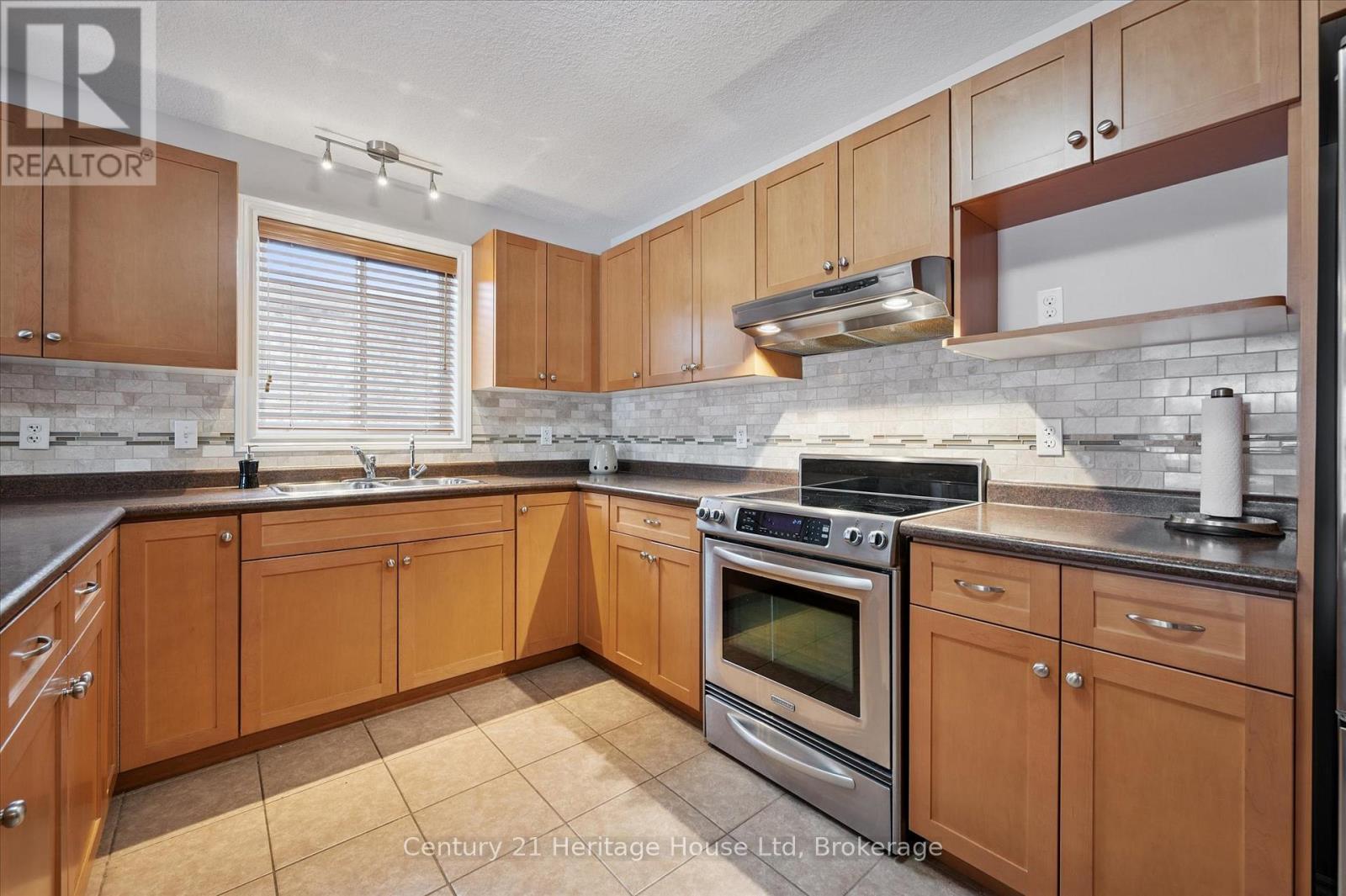 65 Norton Drive, Guelph (Grange Road), ON - Indoor Photo Showing Kitchen With Double Sink