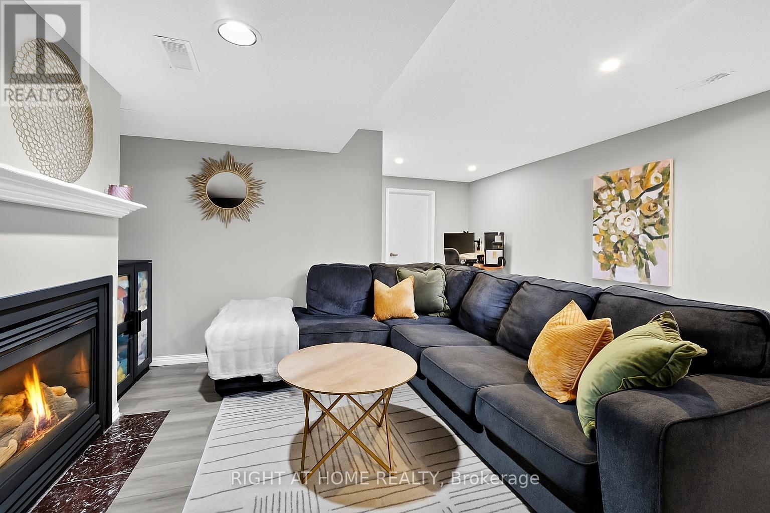 812 Nesting Way, Ottawa, ON - Indoor Photo Showing Living Room With Fireplace