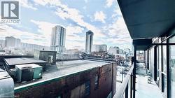Balcony featuring a view of city -
