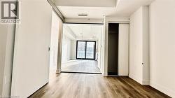 Corridor featuring wood finished floors -