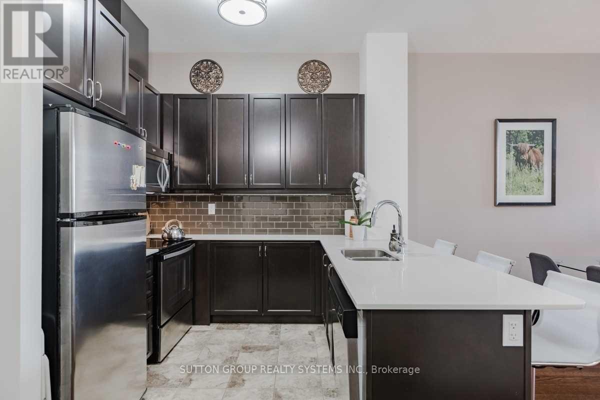 116 - 2480 Prince Michael Drive, Oakville, ON - Indoor Photo Showing Kitchen With Double Sink With Upgraded Kitchen