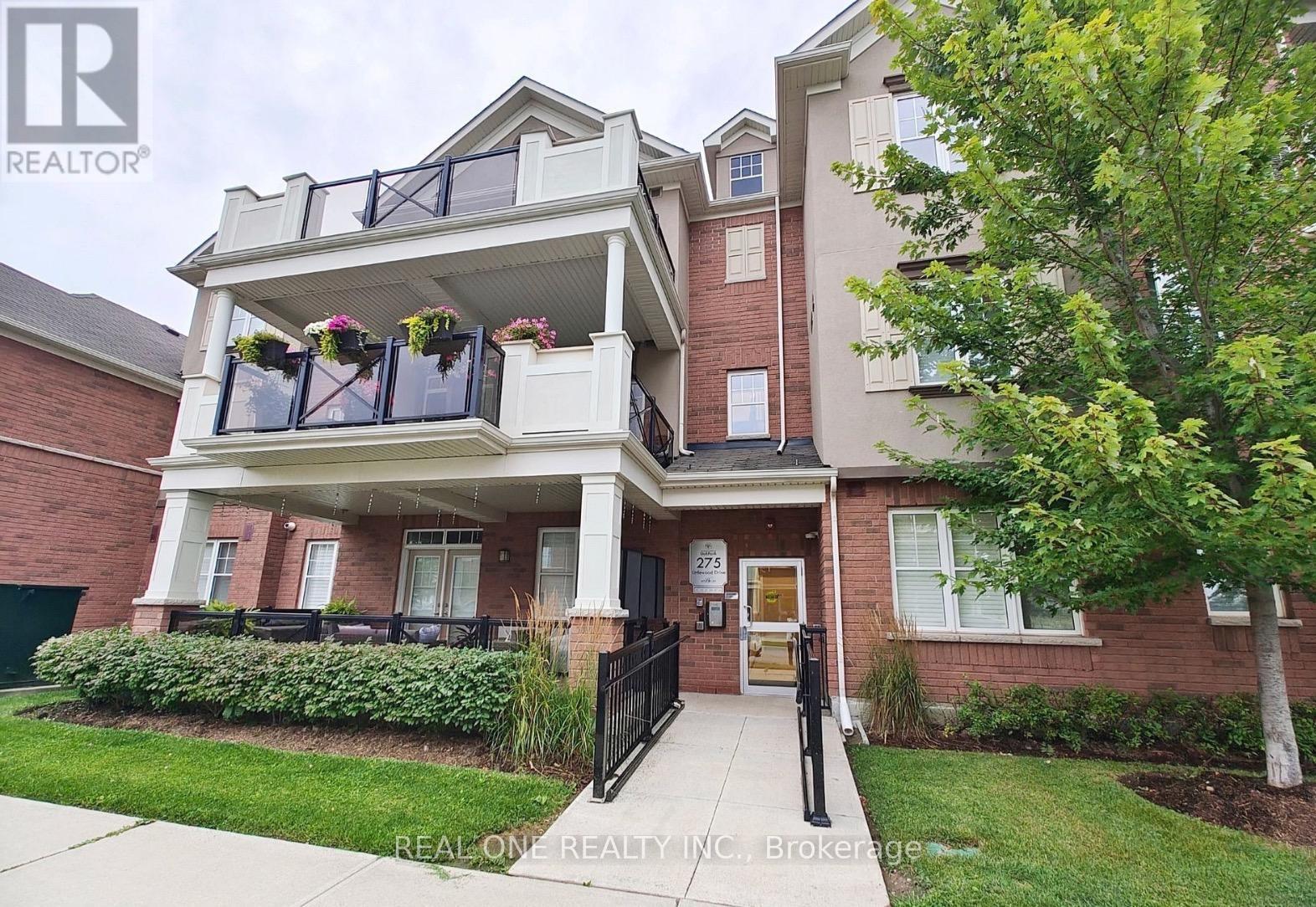 301 - 275 Littlewood Drive, Oakville, ON - Outdoor With Balcony With Facade