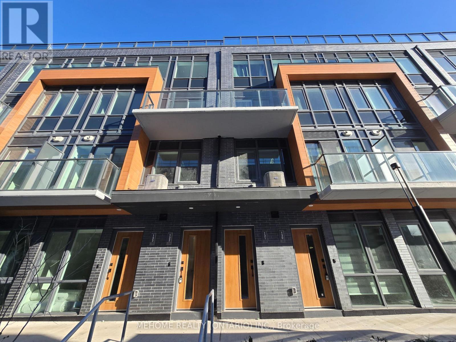 132 - 69 Curlew Drive, Toronto, ON - Outdoor With Balcony With Facade