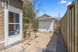 Rear side door to the driveway and garage -