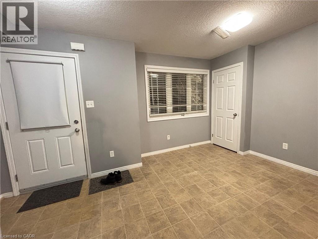 Entryway featuring a textured ceiling - 50 Howe Drive Unit# 12A, Kitchener, ON - Indoor Photo Showing Other Room