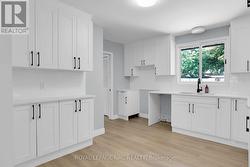 FRESH NEW KITCHEN CABINETRY, SINK AND BACKSPLASH -