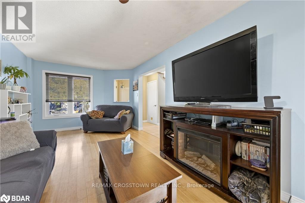 14 Corrie Crescent, Essa, ON - Indoor Photo Showing Living Room With Fireplace