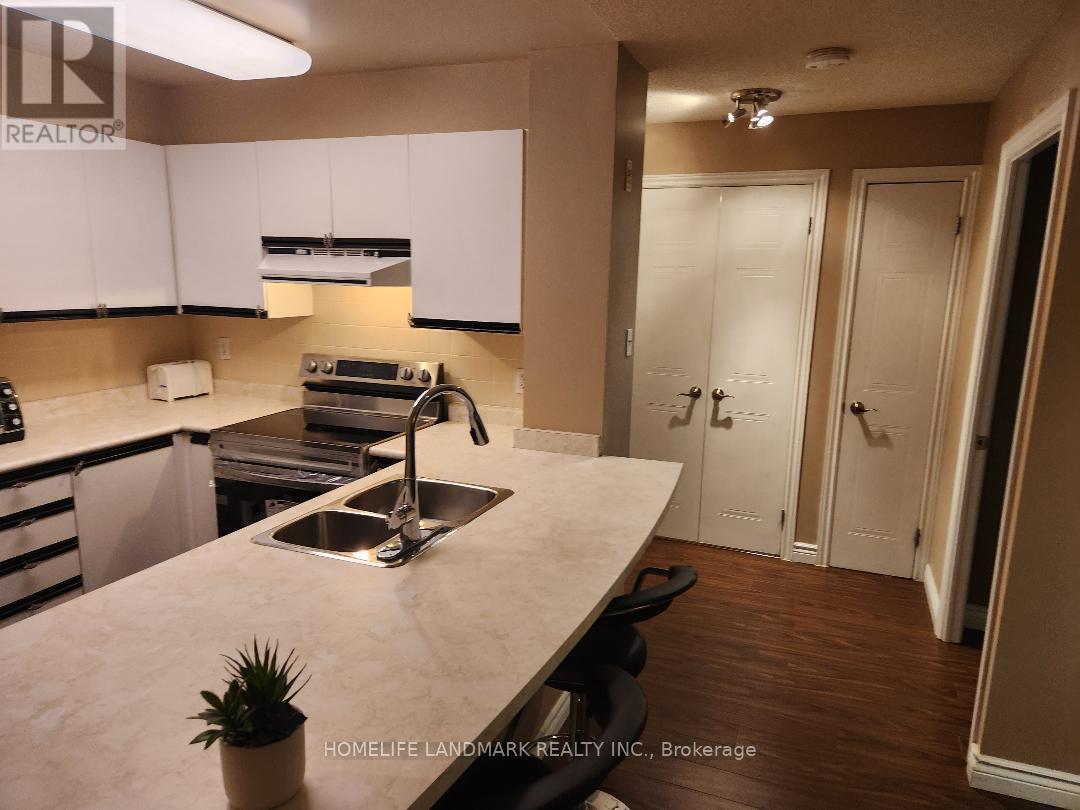 708 - 105 Victoria Street W, Toronto, ON - Indoor Photo Showing Kitchen With Double Sink With Upgraded Kitchen