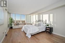 Primary suite w pond view & walk out to balcony. -