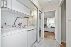 Laundry rm w sink & side by side machines -