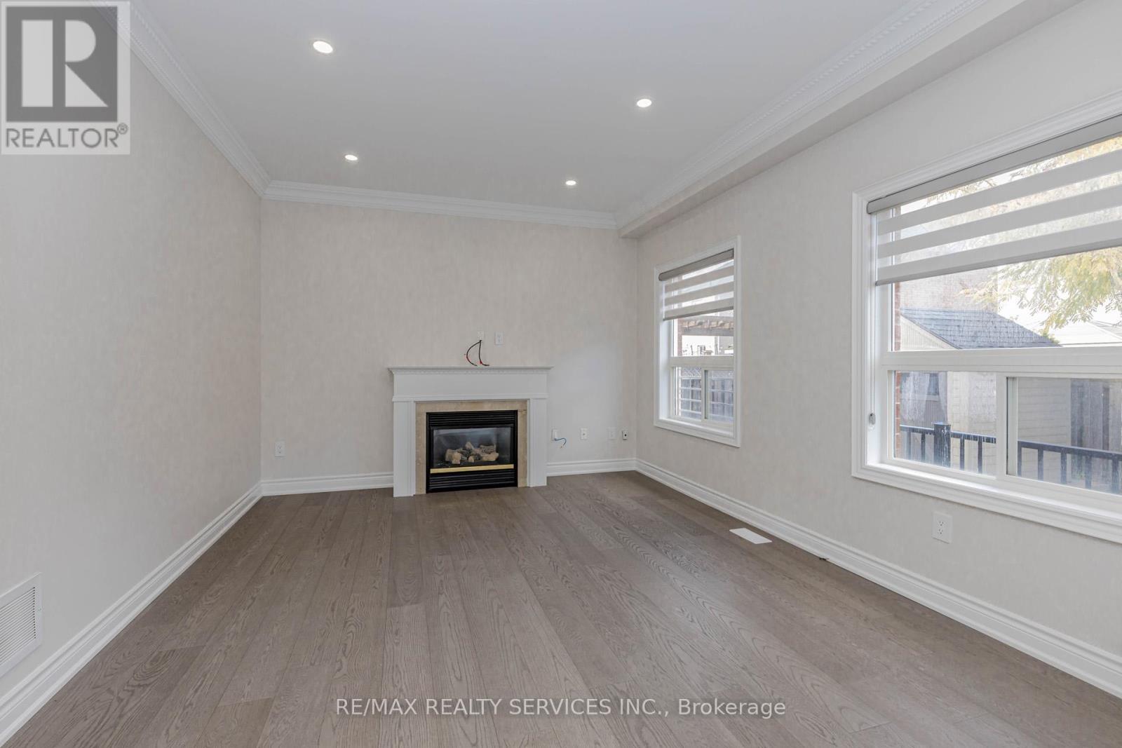 Upper - 50 Amboise Crescent, Brampton, ON - Indoor Photo Showing Other Room With Fireplace