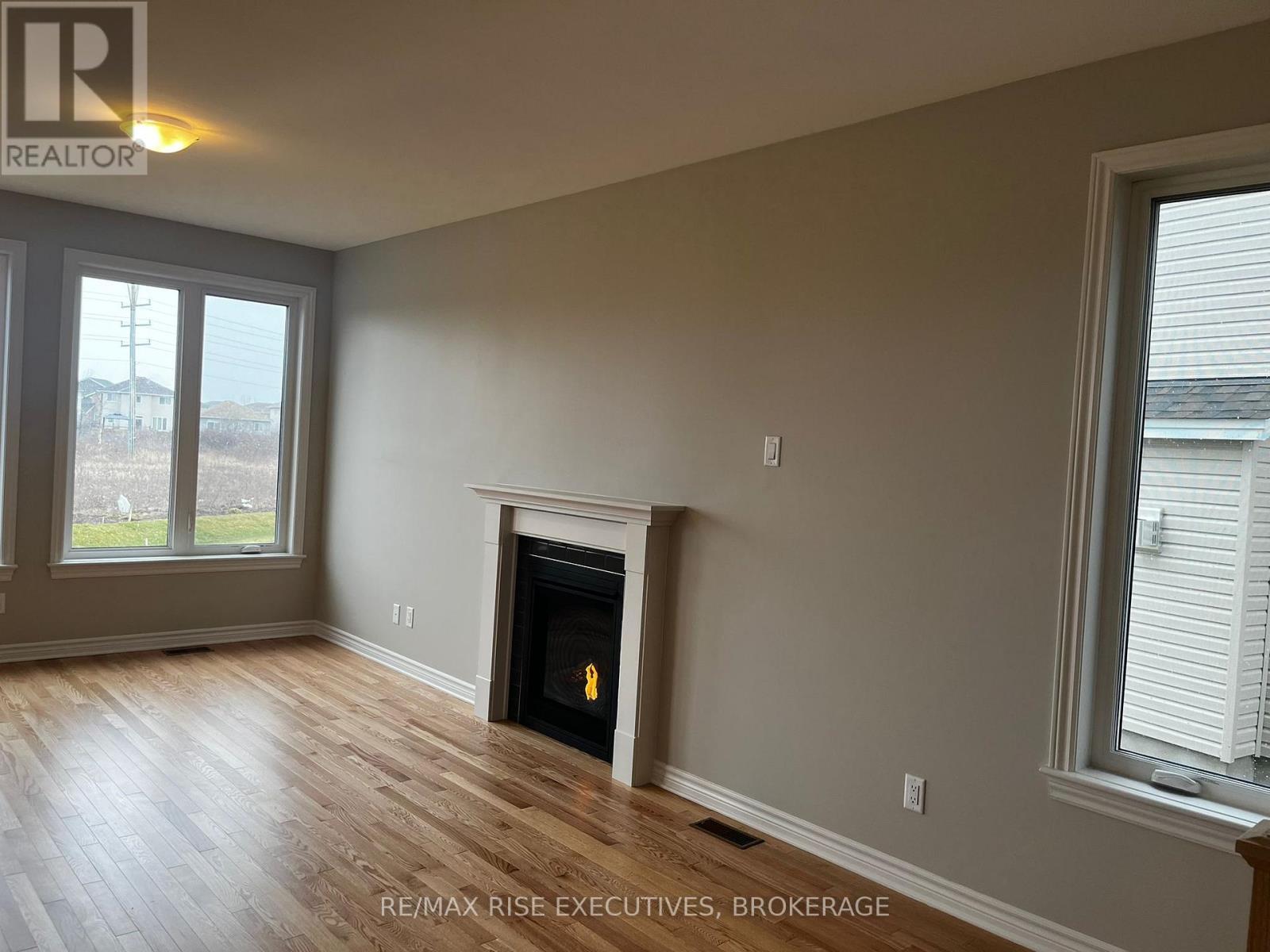 1405 Demers Avenue, Kingston (East Gardiners Rd), ON - Indoor Photo Showing Other Room With Fireplace