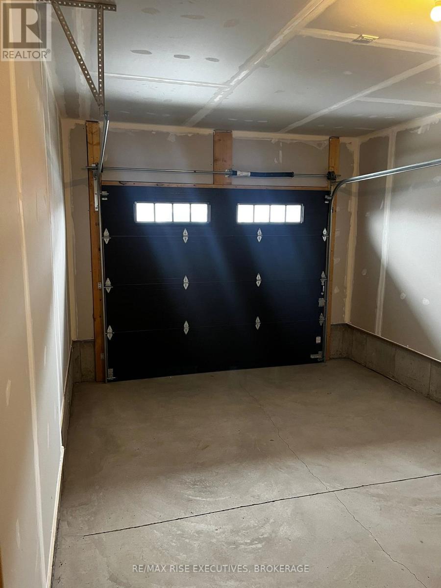 1405 Demers Avenue, Kingston (East Gardiners Rd), ON - Indoor Photo Showing Garage