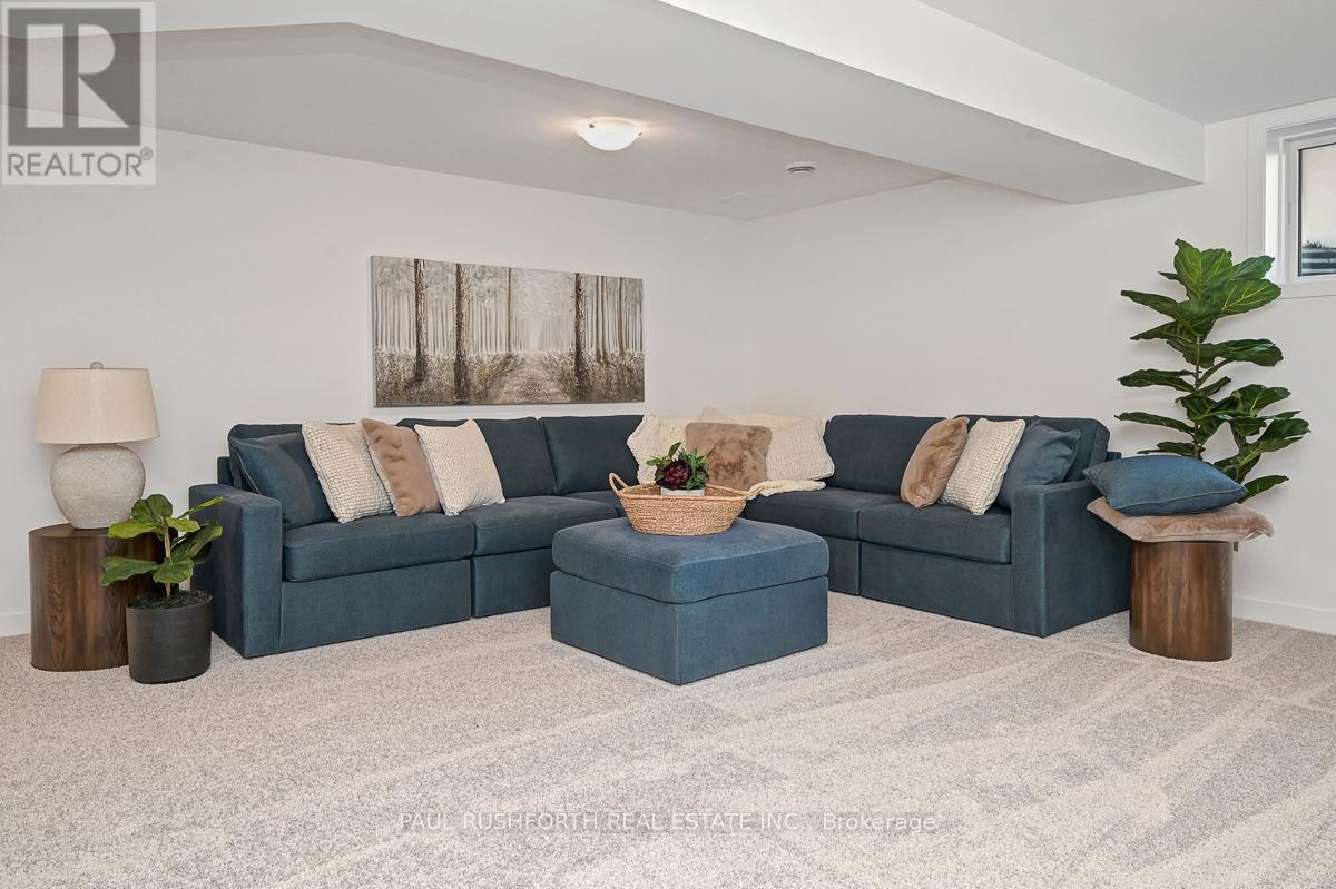 Model Home 201 Peacock-Finished Basement - 233 Peacock Drive, Russell, ON - Indoor Photo Showing Living Room