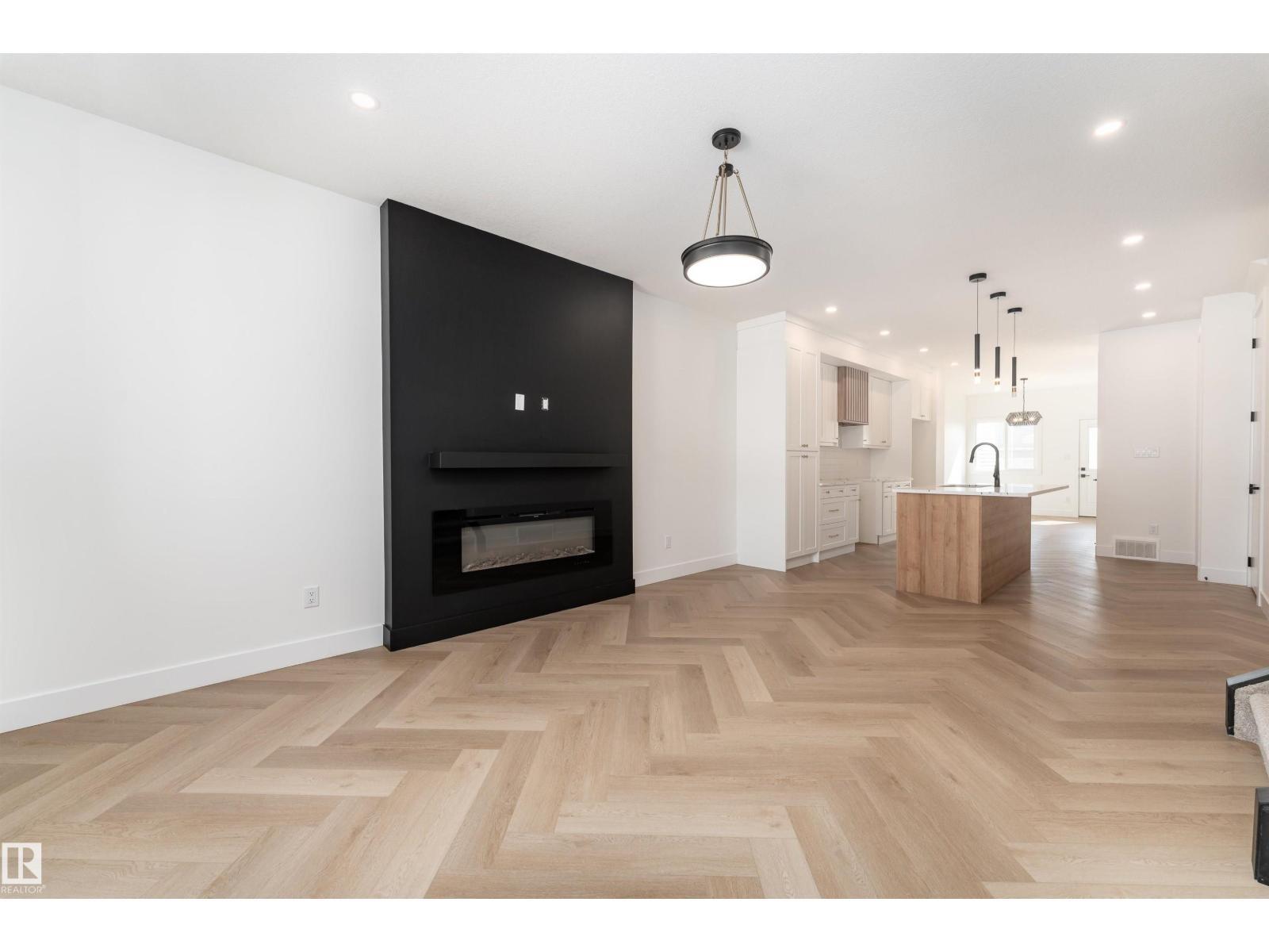3127 Magpie Wy Nw, Edmonton, AB - Indoor Photo Showing Living Room With Fireplace