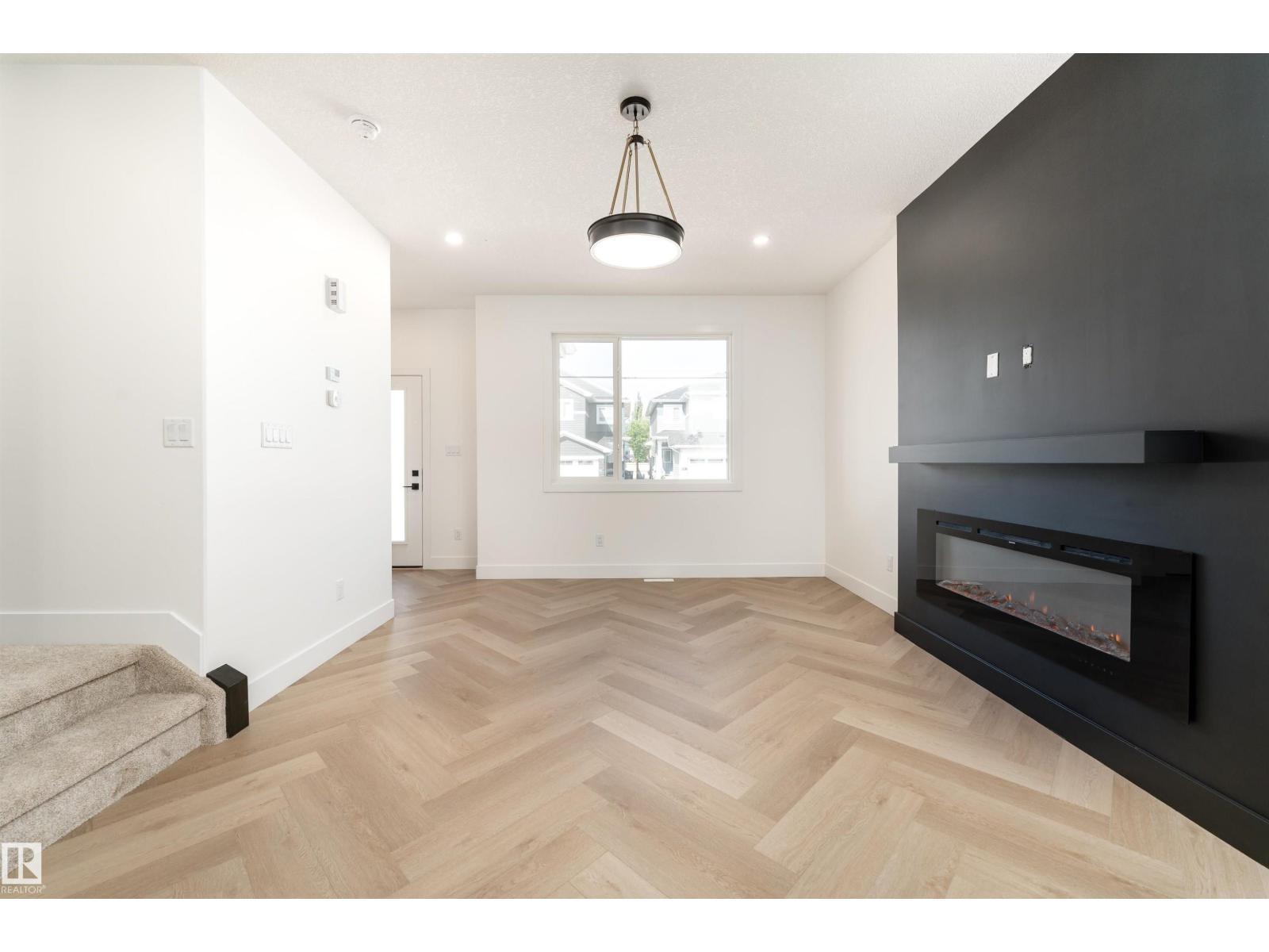3127 Magpie Wy Nw, Edmonton, AB - Indoor Photo Showing Living Room With Fireplace