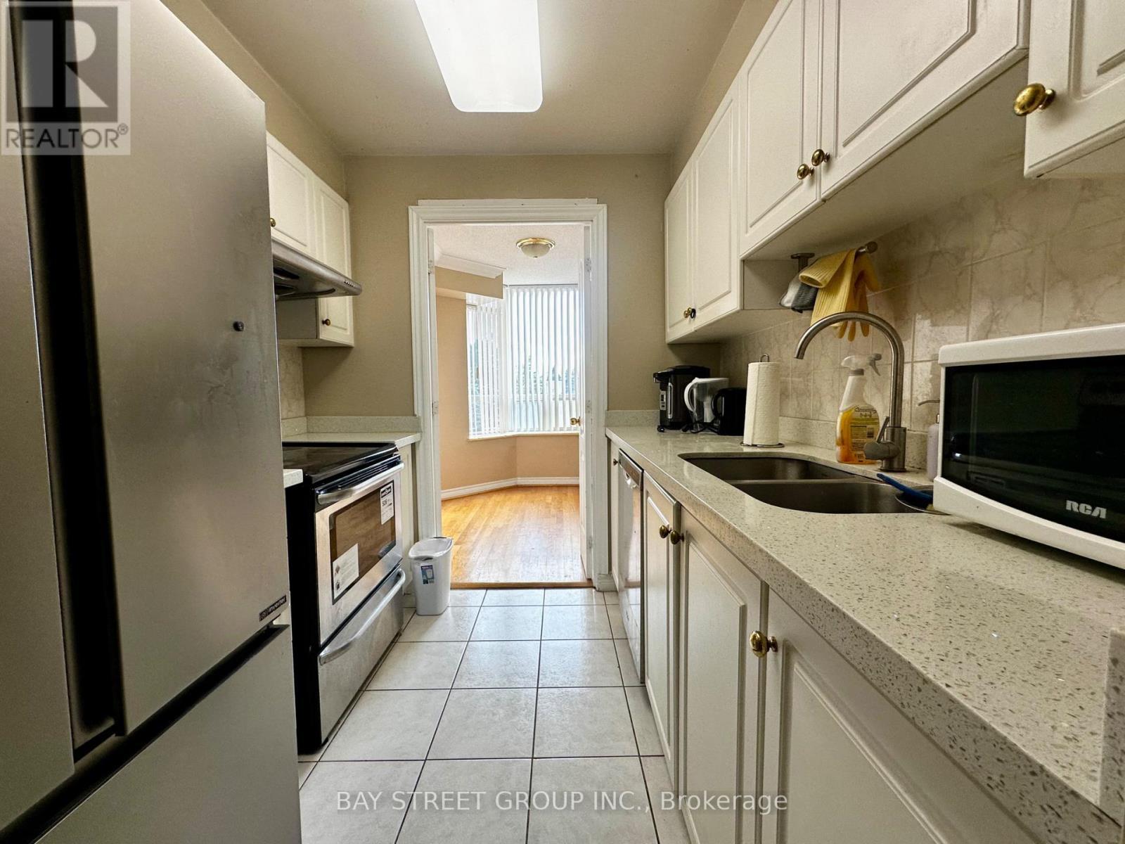 203 - 1883 Mcnicoll Avenue, Toronto, ON - Indoor Photo Showing Kitchen With Double Sink