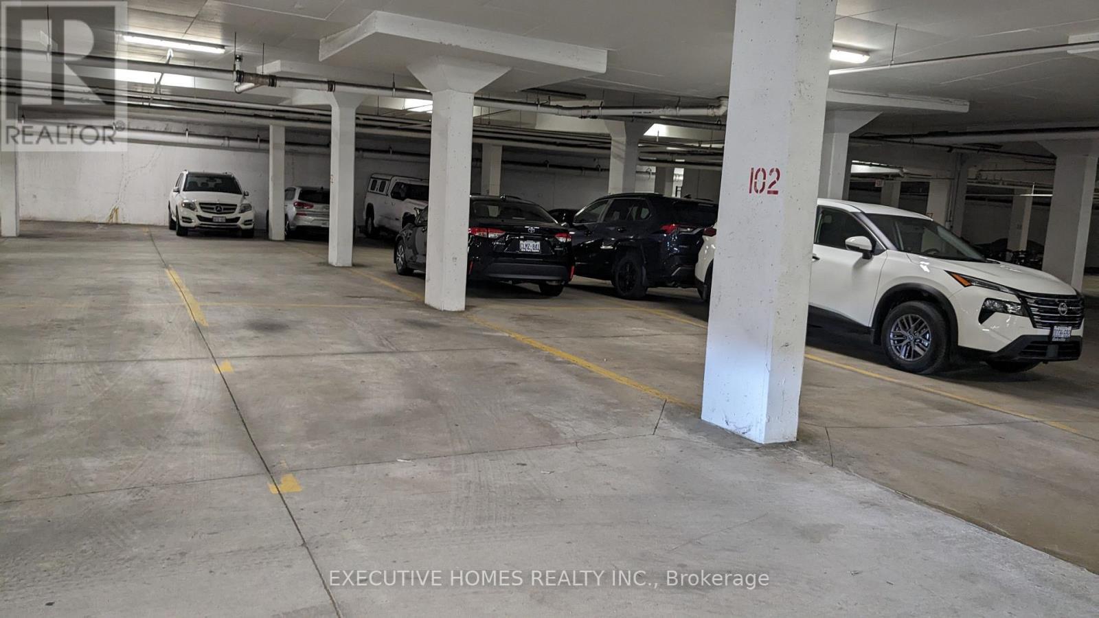 307 - 2379 Central Park Drive, Oakville, ON - Indoor Photo Showing Garage