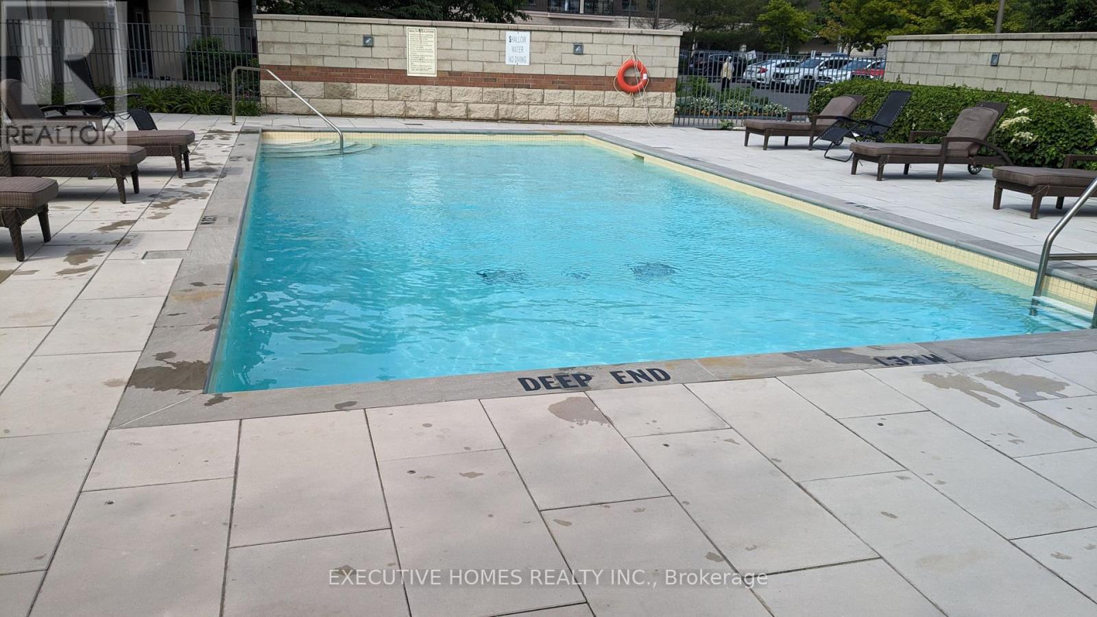 307 - 2379 Central Park Drive, Oakville, ON - Outdoor With In Ground Pool