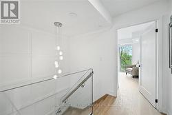 Showpiece Staircase Enhanced with Glass Panels -