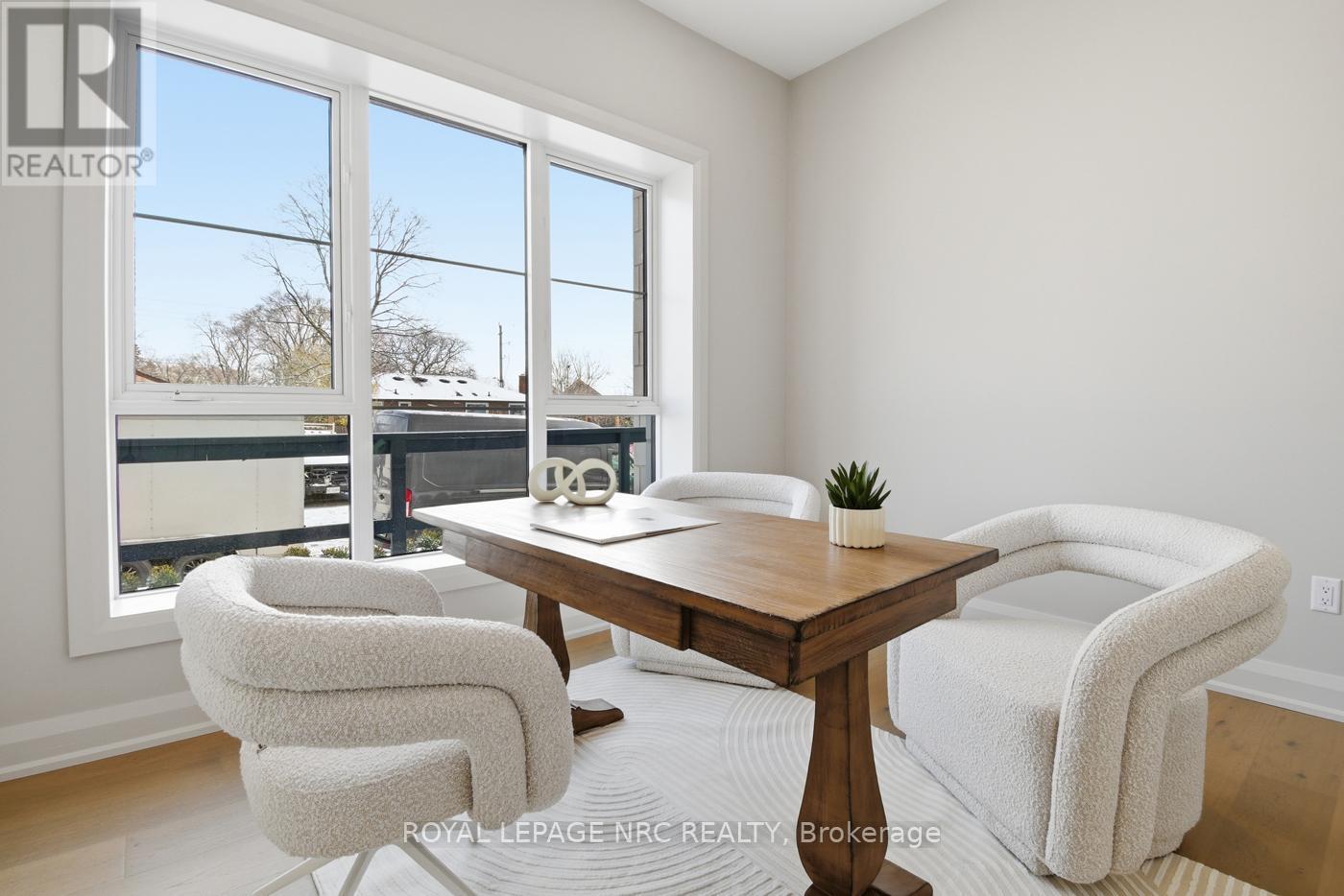 Model Suite 101 - 204 - 2 Arbourvale Common, St. Catharines (Glendale/Glenridge), ON - Indoor With Fireplace