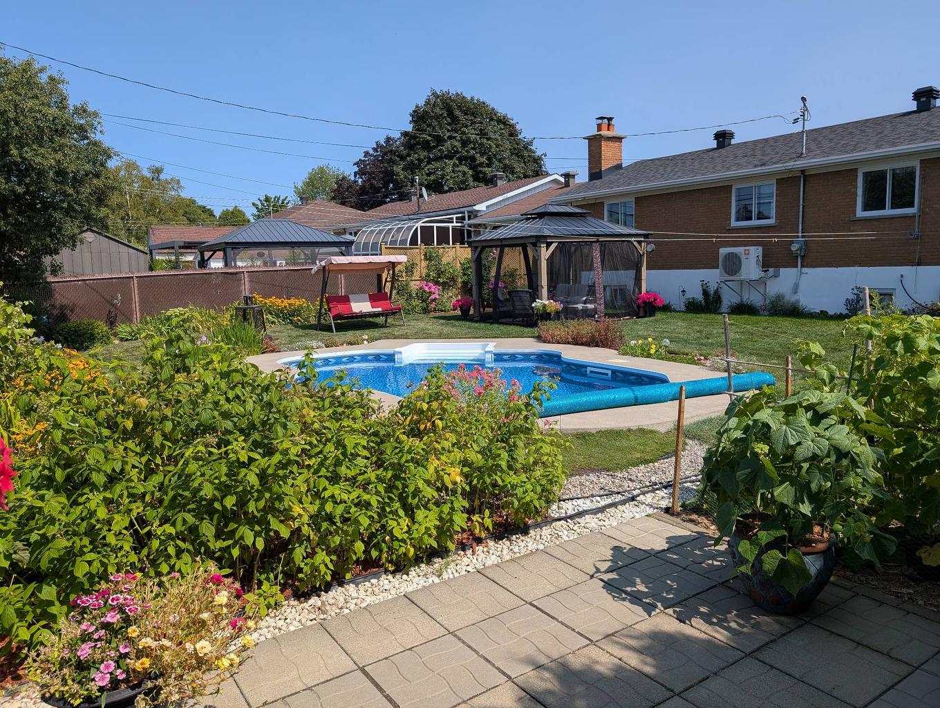 Cour - 365 Rue Papillon, Laval (Auteuil), QC - Outdoor With In Ground Pool With Backyard