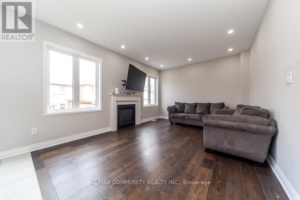 24 Raithby Crescent, Ajax, ON - Indoor Photo Showing Living Room With Fireplace