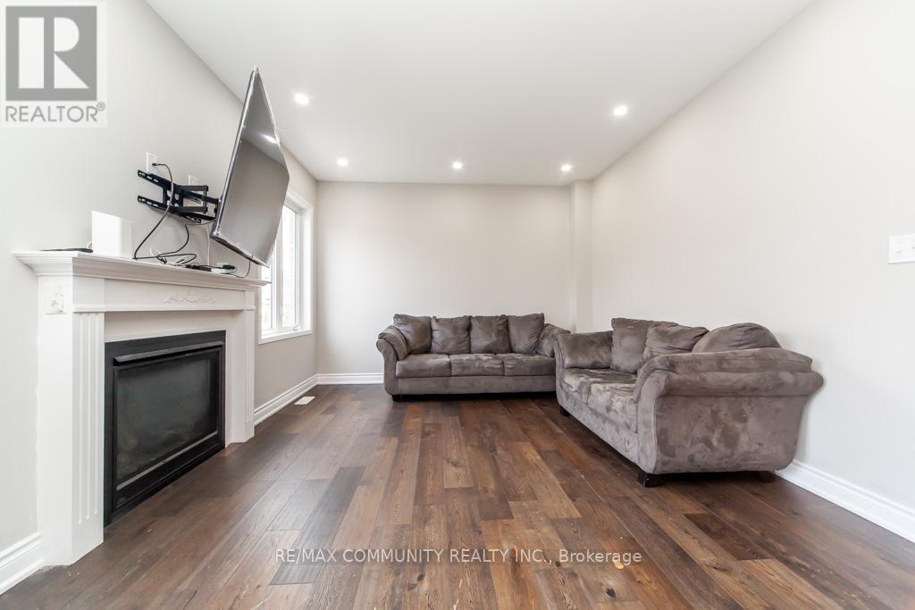 24 Raithby Crescent, Ajax, ON - Indoor Photo Showing Living Room With Fireplace
