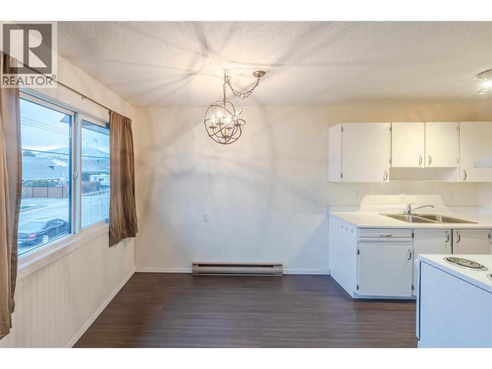 198 Roy Avenue Unit# 204, Penticton, BC - Indoor Photo Showing Kitchen With Double Sink