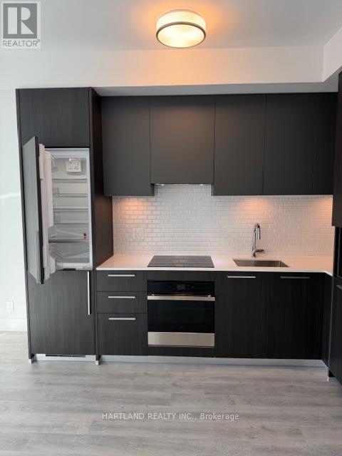 Integrated appliances - 1110 - 65 Broadway Avenue, Toronto, ON - Indoor Photo Showing Kitchen