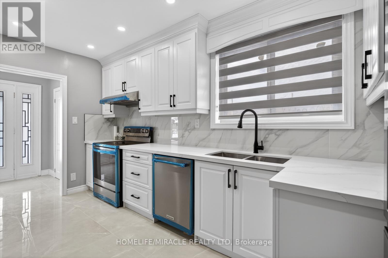 18 Rubydale Gardens, Toronto, ON - Indoor Photo Showing Kitchen With Double Sink