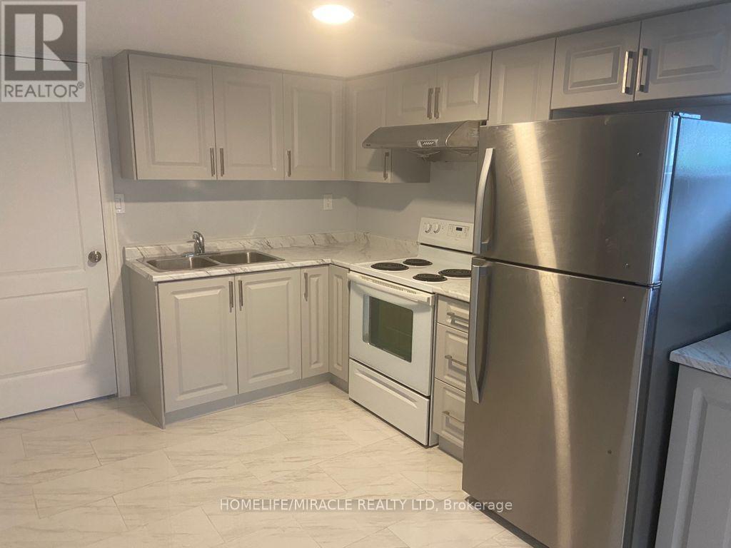 18 Rubydale Gardens, Toronto, ON - Indoor Photo Showing Kitchen With Double Sink