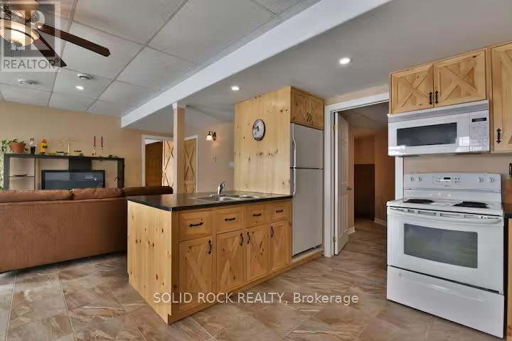 Kitchen with fridge, stove & micro, no dishwasher - 5 Shoreline Road, Edwardsburgh/Cardinal, ON - Indoor Photo Showing Kitchen With Double Sink