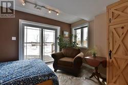 Sitting area in 2nd bedroom-check out river view! -