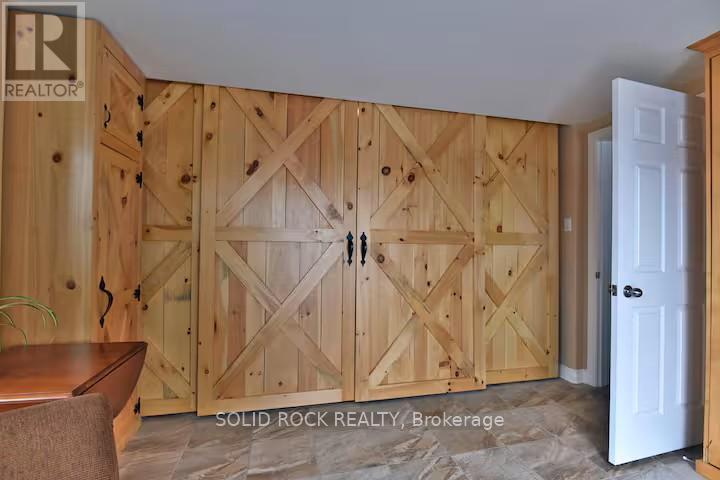Barn doors between 2nd bdrm & primary bdrm - 5 Shoreline Road, Edwardsburgh/Cardinal, ON - Indoor Photo Showing Other Room
