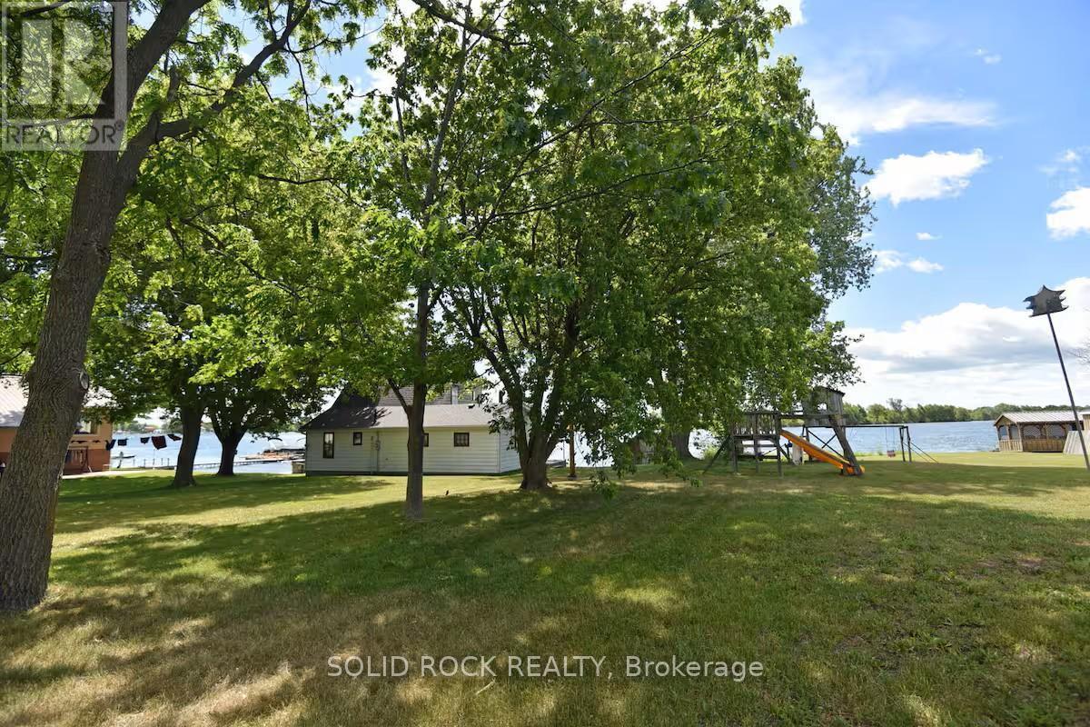 View - play structure &neighbours 3-season cottage - 5 Shoreline Road, Edwardsburgh/Cardinal, ON - Outdoor