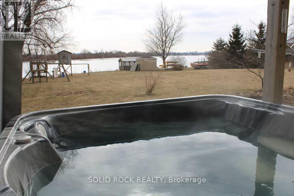 Waterfront view from hot tub - 5 Shoreline Road, Edwardsburgh/Cardinal, ON - Outdoor With Body Of Water