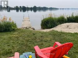 View of kids sand pile & dock -