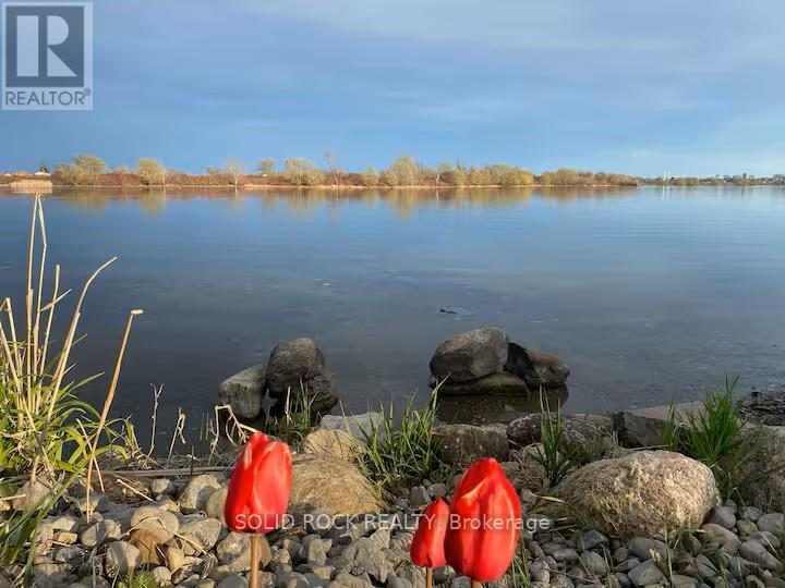 Spring tulips! - 5 Shoreline Road, Edwardsburgh/Cardinal, ON - Outdoor With Body Of Water With View