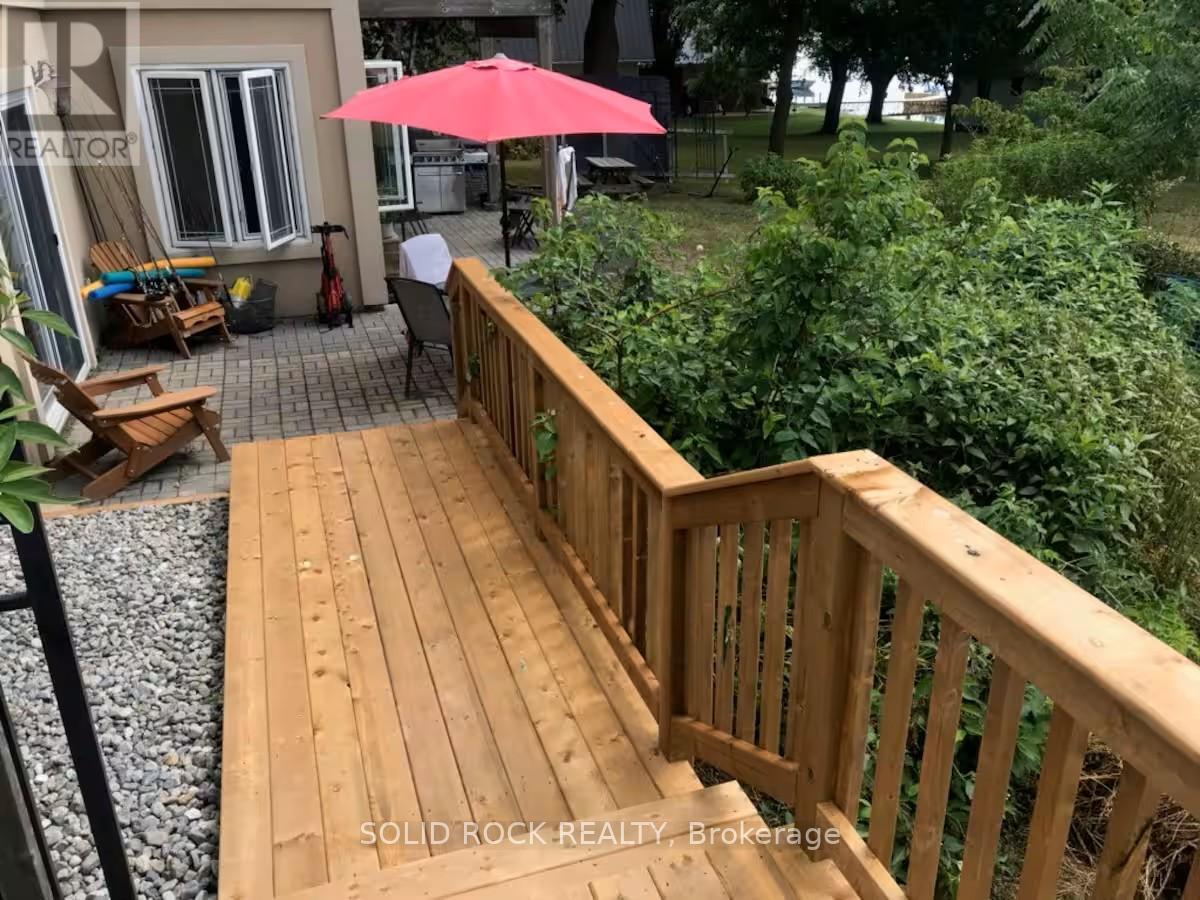 2nd half of stairs lead to huge patio - 5 Shoreline Road, Edwardsburgh/Cardinal, ON - Outdoor With Deck Patio Veranda