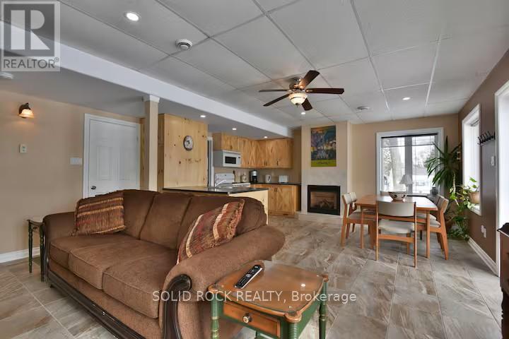 36 x 12 ft great room with 4 huge windows - 5 Shoreline Road, Edwardsburgh/Cardinal, ON - Indoor Photo Showing Living Room