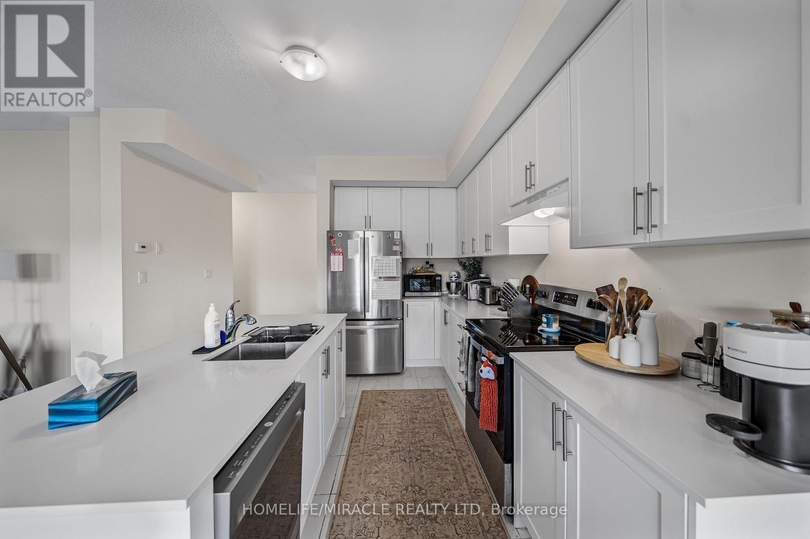 76 Oakmont Drive, Loyalist, ON - Indoor Photo Showing Kitchen With Double Sink