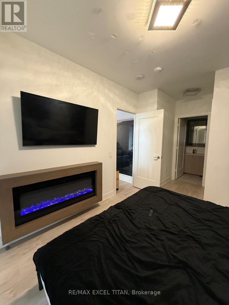 906 - 65 Annie Craig Drive, Toronto, ON - Indoor With Fireplace