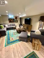 Basement family room with gas Napolean fireplace. -