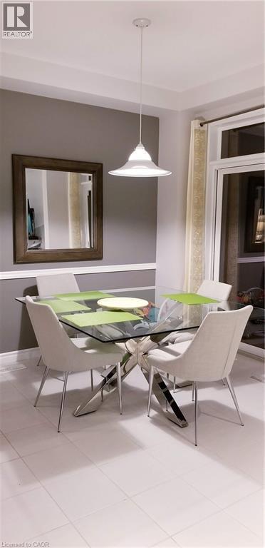 Dining room featuring light tile patterned floors - 118 Steeplechase Way, Waterloo, ON - Indoor Photo Showing Dining Room