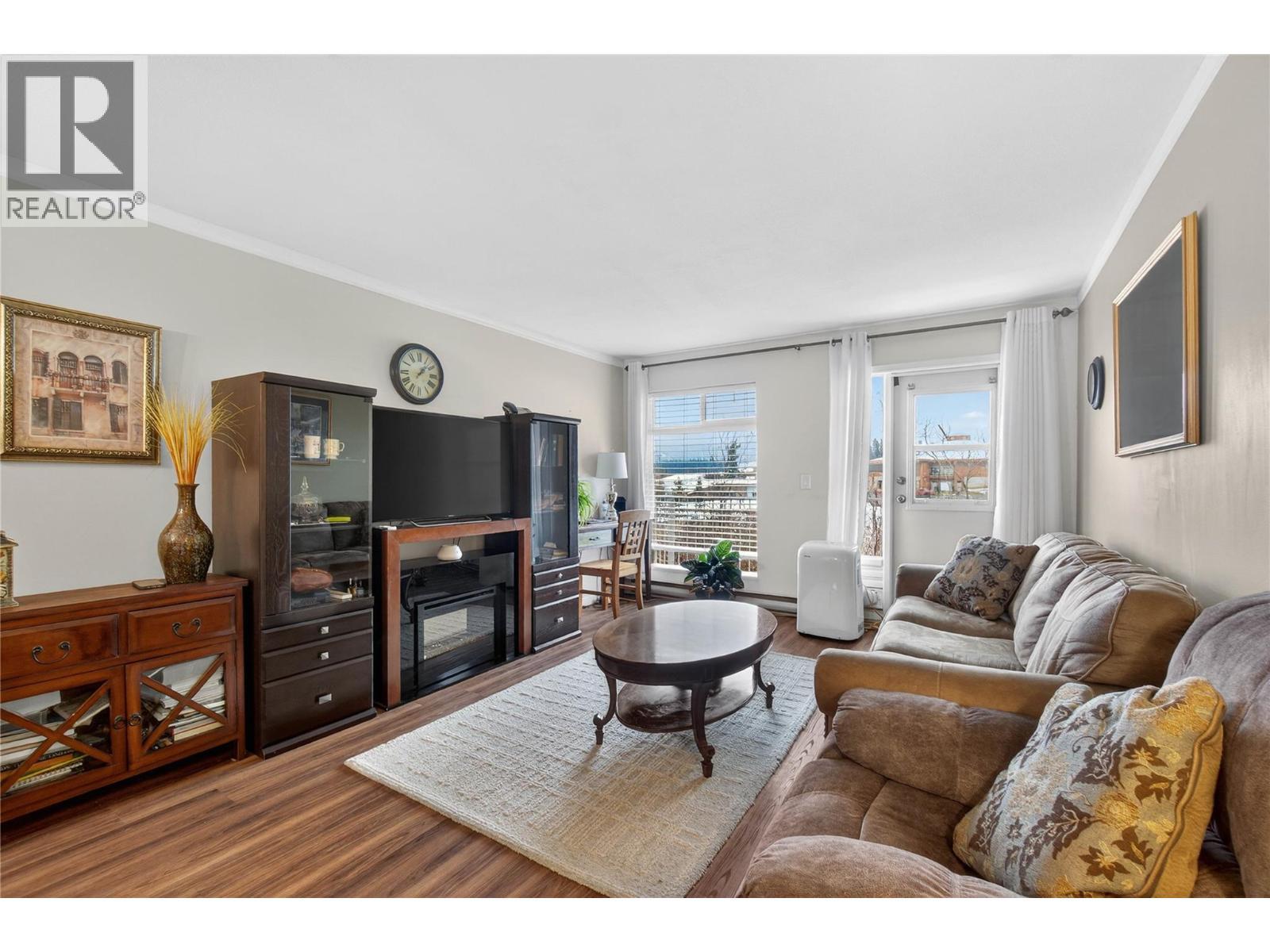 103 George Street Unit# 202, Enderby, BC - Indoor Photo Showing Living Room With Fireplace