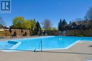 102 - 1795 Marsala Crescent, Ottawa, ON - Outdoor With In Ground Pool With Backyard