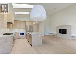 Open concept living room with electric fireplace -