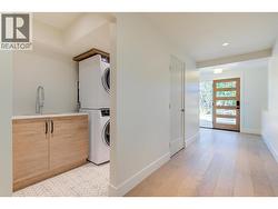 laundry room with sliding barn-style door -