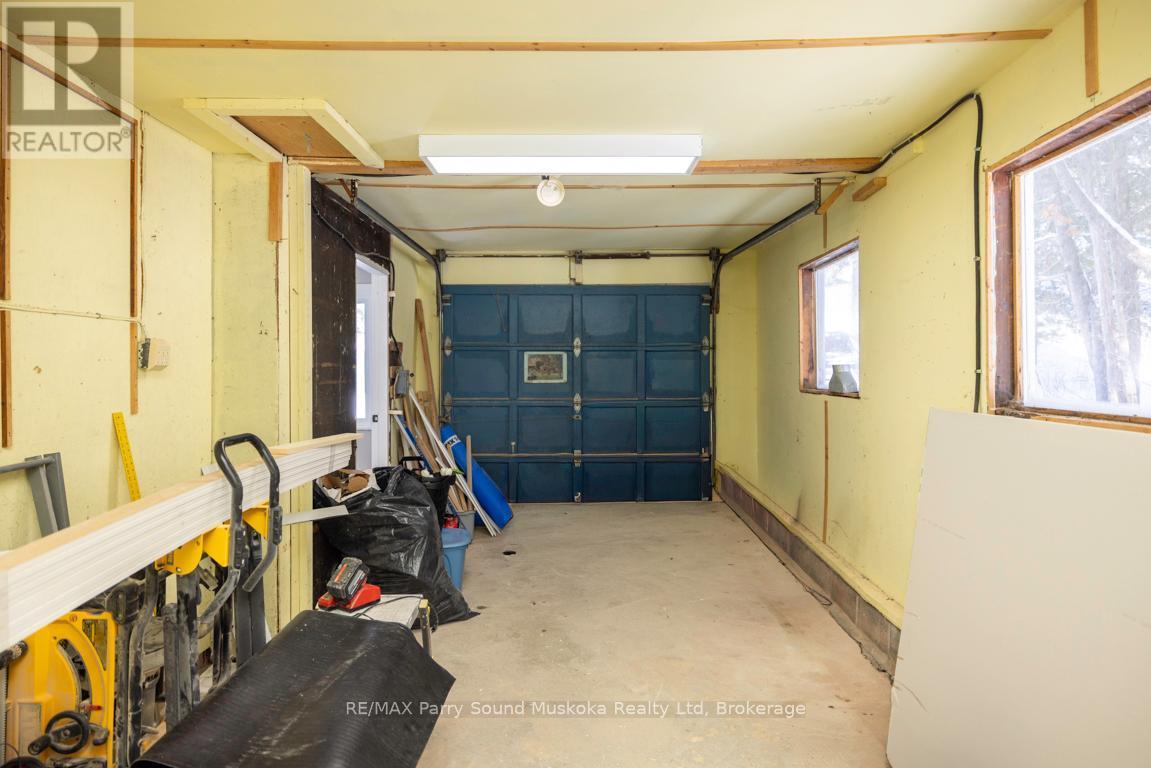 Att'd garage interior - 53 124 Highway, Mcdougall, ON - Indoor Photo Showing Garage